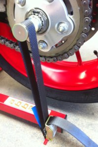 Strap shown fitted around optional Hub Spindle for single sided Swing-Arm machines.