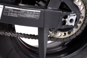 Strap attached around swing arm.
